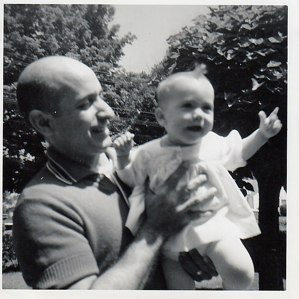 The author, a photo manager in Southern Oregon, as a baby being held by her loving father.