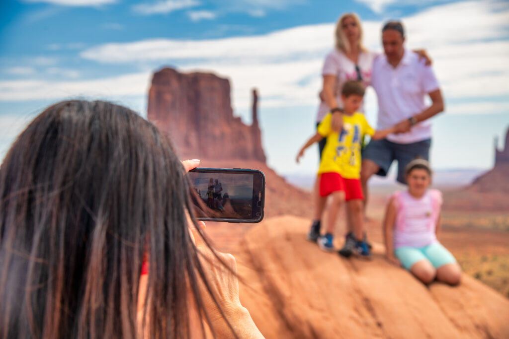 A Southern Oregon photo manager's client taking a meaningful family photo on vacation to Monument Valley to save the memory forever.