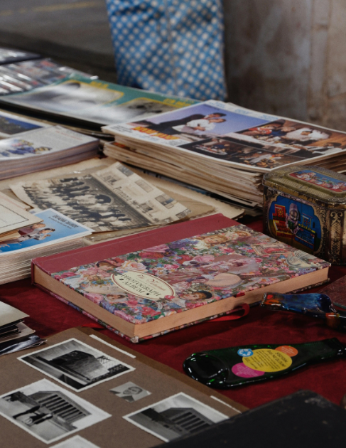 A table filled with a variety of photo albums from different eras makes a Southern Oregon photo manager's point that our photos are important to us.
