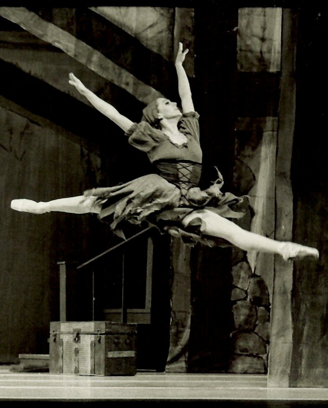 The author as a professional ballet dancer in the role of Cinderella, in a mid-air leap.